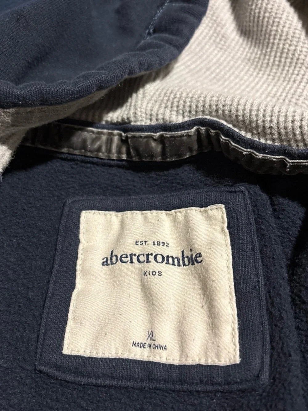 abercrombie kids navy zip-up hoodie with cream lettering